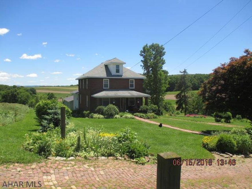 Please do not drive back private drive without appointment.  Beautiful 2 story brick farmhouse situated on 8.1 scenic acres including two ponds, outbuildings and large old barn.  Home has too many updates and features to list them all.  2016 additions include the open floor plan kitchen, dining room, laundry and half bath and a 30'x46' detached garage was also added in 2016.  Radiant heat in the garage and addition.  Outdoor coal/wood furnace nicely set up under roof at the end of the garage.