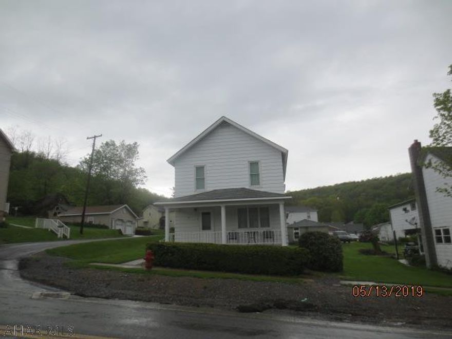 Well maintained home on nice fairly level corner lot and two car garage.