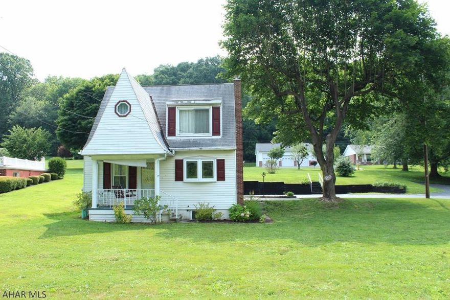 Priced to sell , this house has lots of potential . Nice size yard with paved driveway and 2 car attached garage. 2 bedrooms and 2 baths. Large family room and cozy kitchen.  Oil hot water heat and thermal windows. Appliances and window treatments included. Enjoy the evenings on the front porch swing. Take a look and make an offer.