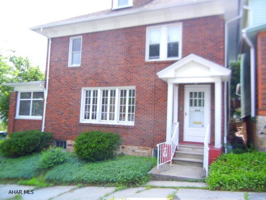 Lovely corner brick in Fairview.  Large living room opens on to side sunroom and features gas fireplace.  Formal dining room with storage and glass doors to sunroom.  Kitchen features eating area.