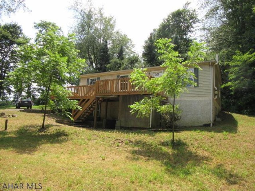 Doublewide on full foundation, large wrap-around deck, walkout basement, This property may qualify for Seller Financing (Vendee).