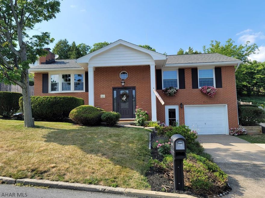 This is a beautifully maintained home with views from almost every window, come sit on the back patio and enjoy the views or relax in the spa room in the hot tub. 4 bedroom 2 bath with family room and florida room for extra space. This home is close to the Altoona Penn State Campus in a very nice neighborhood. You will want to come a see this one, it will not last long!!!