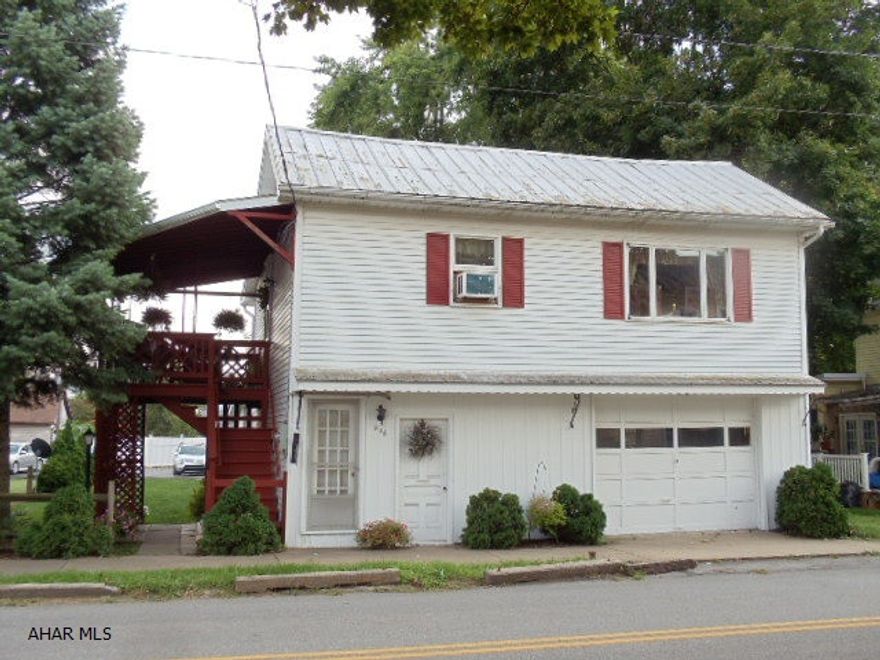 Greater starter home! Nice aluminum-sided 2 bedroom, 2 bath home with sun room, 2nd floor covered deck & 3 car garage, back alley & off-street parking.   #J-155