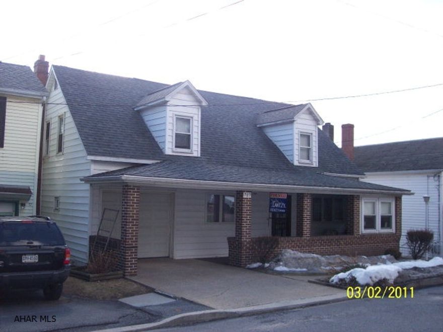 UPDATED CAPE COD ,  WITH CARPET OVER HARDWOOD FLOORS, COAL & OIL HOT WATER HEAT & 1 CAR GARAGE COAL & OIL HOT WATER HEATING