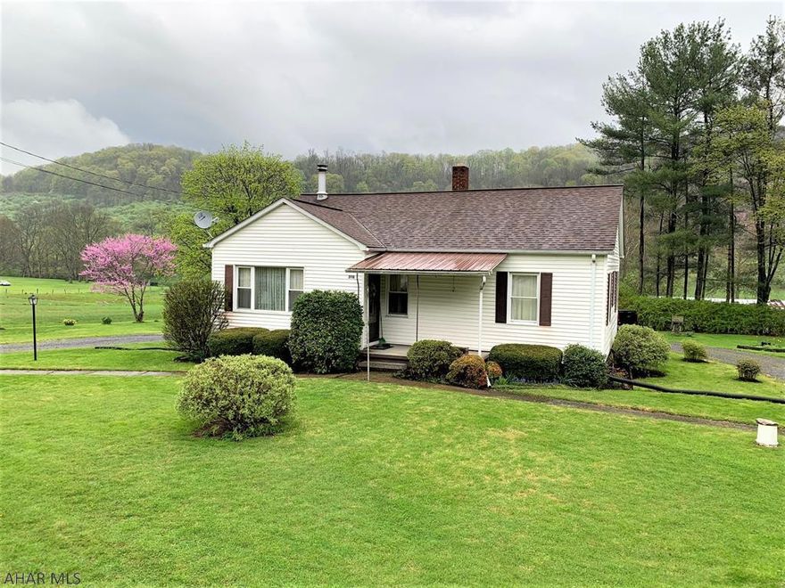This well-maintained and well-loved home rests on 24 scenic acres!! The site offers four separate but contiguous parcels with a peaceful stream, fields and public road frontage. The main level has a living room w/ wood burning fireplace, kitchen with eat-in area and rear entry door, three bedrooms and a full bath. Full basement walk-out basement, laundry room and integral garage. Electric BB, mini split heat pump w/ central air, and wood stove, replacement windows, and 200-amp electric. Convenient location in Bedford County but close to the PA/MD border, Lakes Koon & Gordon, I-68 and Rocky Gap State Park and Resort. If you've been searching for a well-cared for home with acreage, here's your opportunity!!