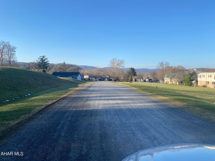 Almost 8 acres.  No zoning.   Small rental property included that was once an office.  Phase I and Phase II completed and remediation completed.   Paperwork available.   Current lease for truck parking  is month to month.