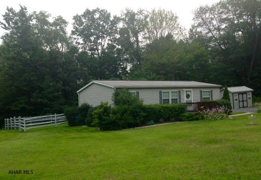 Well maintained 28' x 46' Champion doublewide on footers. Lovely 2.03 private acres with large fenced in area in back. Open kitchen and living room. Master bedroom has a large walk in closet. Two full baths. Excellent water. Most furnishings stay. Beautifully landscaped with Esh's out building. Walking distance to State Game Lands. Nice property, price right.