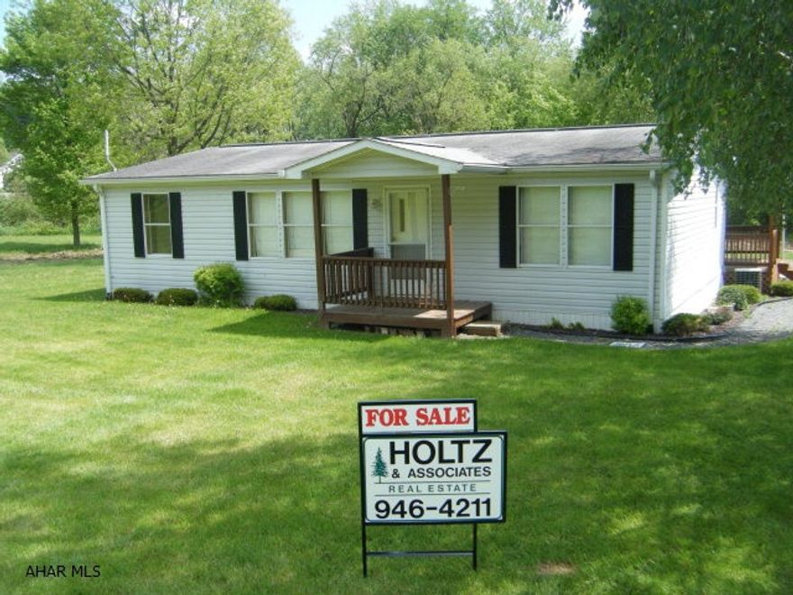 Shared driveway with neighbor on the right. Front yard starts near the for sale sign. The extra lawn in front is mowed by the owner. Creek in rear. Public sewer just installed. Will be tapped on by owner and connected in November 2012. Home is in good condition. Set on piers with skirting. 20x24 Garage is newer and has an earth floor. Owner financing for qualified buyer.