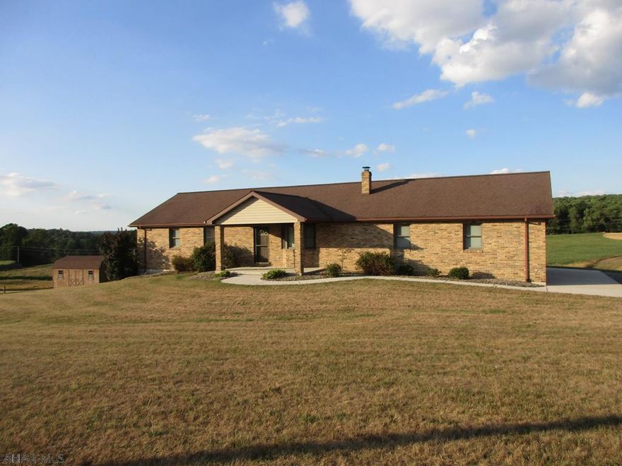 This  well maintained brick  ranch home is situated on approximately 52 acres  featuring a pond,  pole building with 2 stalls and hay loft, garden area with a convenient water spigot and shed and much more!  Enjoy the view of the grounds from a deck with access from the master bedroom. The house features a heated  two car garage with 1/2 bath, beautiful oak kitchen that opens to a living room with  oak flooring and cathedral ceiling, two bedrooms, a  full bath and laundry room on the first floor and a family room and 3rd bedroom/office and 3/4 bath in the finished basement.   Additional features include an outdoor furnace, radiant floor heat in most rooms, central air and much more! Call for more information.