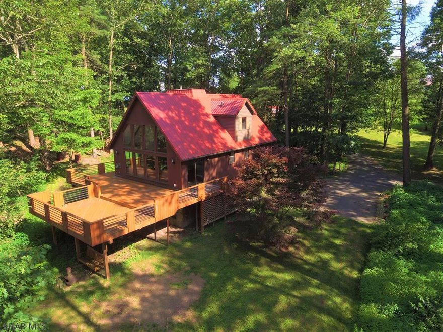 Price reduced to $199,900!! This spectacular home wont last long at this price! Are you looking for a private getaway or a forever home in the mountains surrounded by nature with a view? Well look no further. This A-frame home sits on a bluff over the Juniata River offering views of the river and countryside. Conveniently located less than 5 miles from town this home offers 3 bedrooms, 3 baths, multi level stone fireplace, great room w/ cathedral ceiling, finished basement, large deck, internal garage, shed, paved driveway, river frontage, and much more!