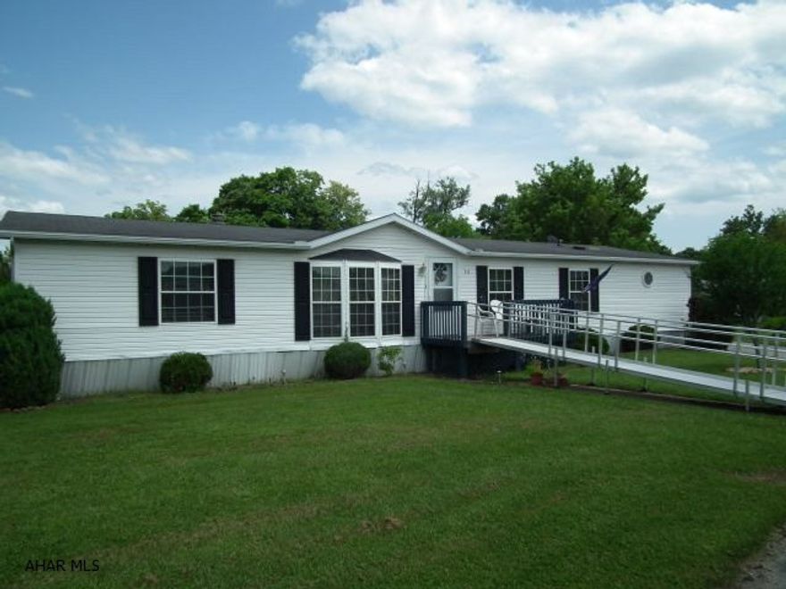 Spacious 68 x 28 home with bright and cheery kitchen with loads of cabinets, breakfast serving area, eating area in kitchen, dining room area, large family room, living room with fireplace, detached garage, and covered deck. Agent has information on file for financing. Lost Buyer-Extremely Motivated Seller!