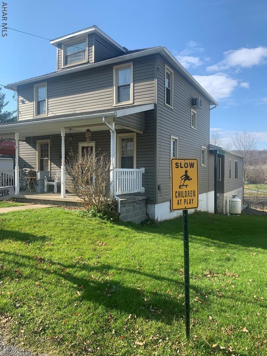 Beautiful remodeled two story home with a 30x33 one story addition. With over 2100 square feet of living space the home in on 3 lots with a detached two car garage and a carport, side and rear deck with a nice view and fenced in rear yard for the pets. Inside the home features an oak kitchen with dining area, living room, half bath, large family room with fireplace and built in shelving, first floor master bedroom with large walkin closet and bath including jet tub and separate shower. A Florida room leads to the rear covered deck overlooking Clearfield Creek. The second floor has 3 bedrooms and a modern 3/4 bath. Large attic for storage. Full basment includes overhead door to store atv's. This is an exceptional home.