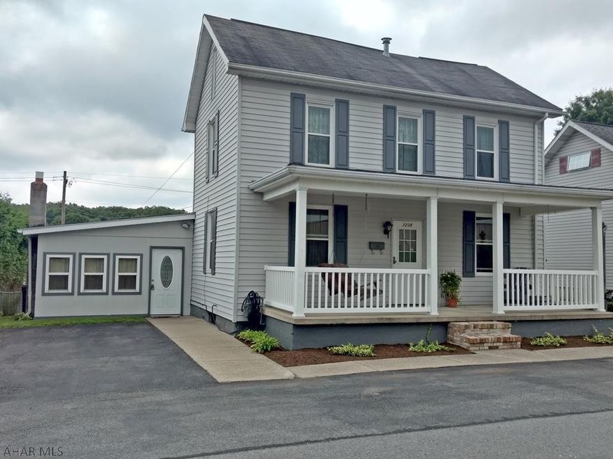 Beautiful 2 1/2 story Antis Township home.  Three bedrooms, 1 3/4 bath, remodeled kitchen includes all appliances.  Vinyl siding and updated windows, composite deck, fenced yard, storage shed.  Sunken family room and convenient first floor laundry and bath!  Front porch, off street parking.