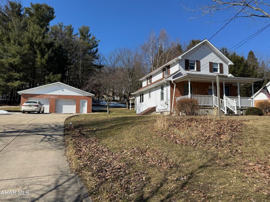 Vinyl and brick sided two story home featuring 3 bedrooms, 2 bathrooms, equipped kitchen with beautiful cabinets, Nice living room, 1st floor bedroom and 3/4 bath. The second floor has a large open multiple use room, 2 bedrooms and a full bath.  Attic storage with pull down steps. Full basement with oil hw heat and a separate coal/wood furnace.  Large (9/10) acre lot with picnic pavilion. Beautiful 2.5 car detached garage with concrete driveway. Great home for the $$.