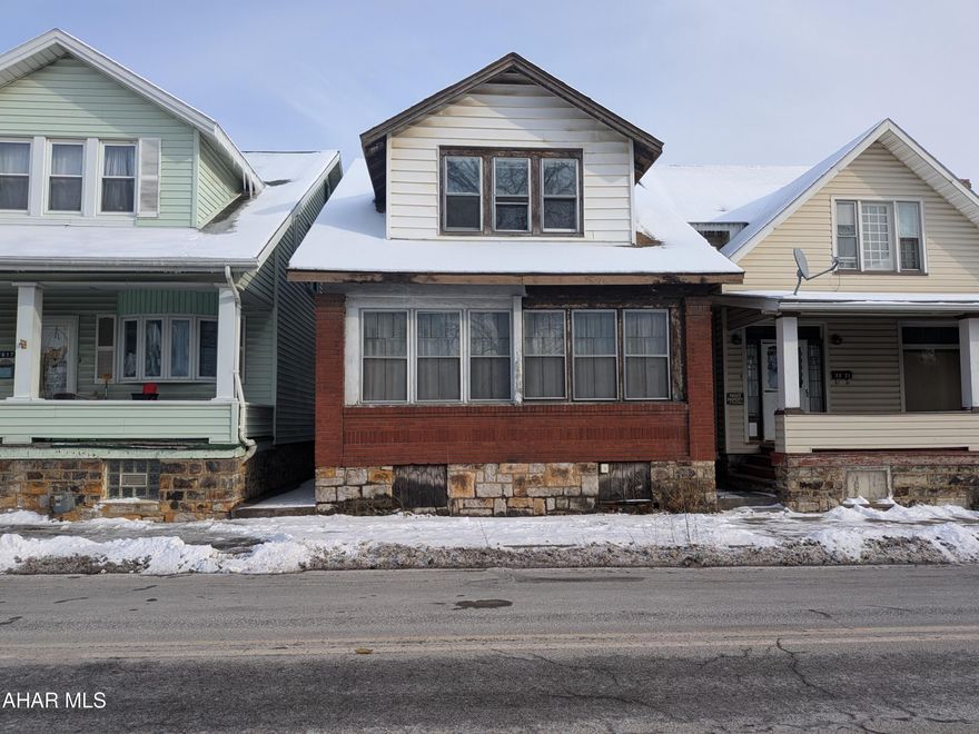 One and one half story brick home with lots of potential!  A perfect home to fix and flip, rent, or keep as a primary residence!  The home features 3 bedrooms and 1 full bath.  There is off-street parking behind the home.