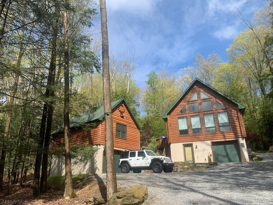 Mostly furnished, 2 bed/2 bath log-sided home with loft and garage located on 1.5 wooded acres. Additional detached, log-sided garage with game-room above that has a 9ft slate pool table that conveys. Finished “mancave” on ground floor with bar, futon and bath. Matching, custom built log-sided shed with work bench & plenty of storage space. Beautifully landscaped stone patio outback with outdoor kitchen, granite bar & dining table, fire pit and bubbling rock fountain. Furnishings include rustic log beds, dresser, chest of drawers and dining table. Three flatscreen T.V.'s will also convey.