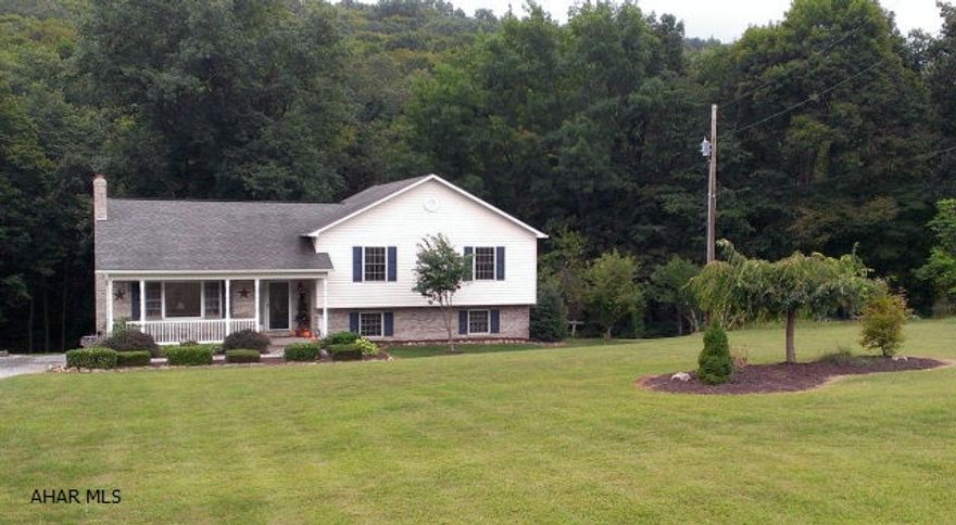 Here's an absolutely like new, one-owner 4 bed/2 bath home just south of Bedford, with an immense front and back yard blending into the scenic hillside.  The 8.8 acre lot offers plenty of play and entertain space for the entire family.  Inside, a spacious oak kitchen and dining room as well as a large screened in porch leading outside to a bi-level deck with hot tub.  A cozy lower level family room is perfect for upcoming sports games.  A beautiful home that is priced to sell.  IT WON'T LAST LONG!