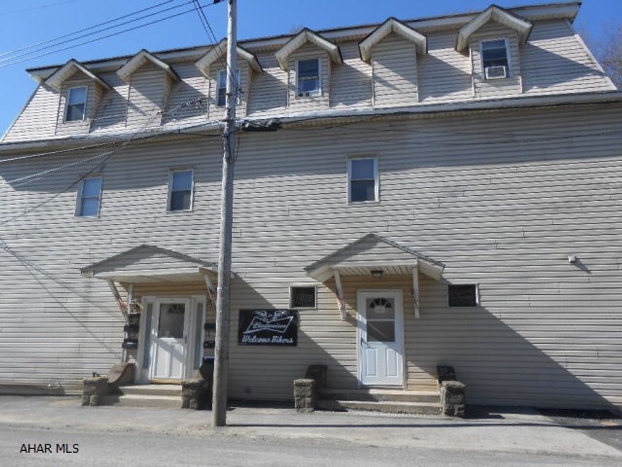 Hotel w/Hotel License/Liquor License,smoking License,amusement permit,cable through out,kitchen equipment,new auto fed coal furnace,new draft system/bar stools and large party/dining hall to name a few of the many amenities that this business opportunity offers.3rd floor nicely laid out/spacious.All 5 units currently rented. All units are owner furnished.All liquor will be inventoried and sold separate to buyer per liquor control board regulations. offers large parking area.Natural gas scheduled for 2016-2017.Buyers have to apply for all License.Reduced price is firm.