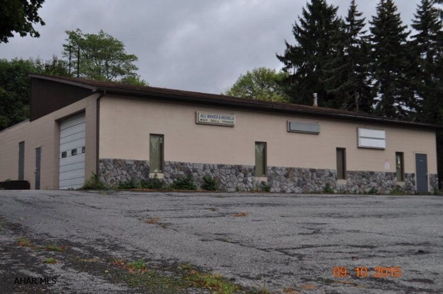 Fantastic business opportunity in the Greenwood area.   High traffic location.   Large commercial building with a large show room and retail space.   This would be perfect for many types of business.   Large office space.  This building has both heat and central air.    Large paved parking lot. The building has a Logan Township Occupancy permit from the Commonwealth of PA. The garage doors are 10 feet tall.   The ceilings in the front of the building are 14 feet high and the back of the building are 8 feet high.