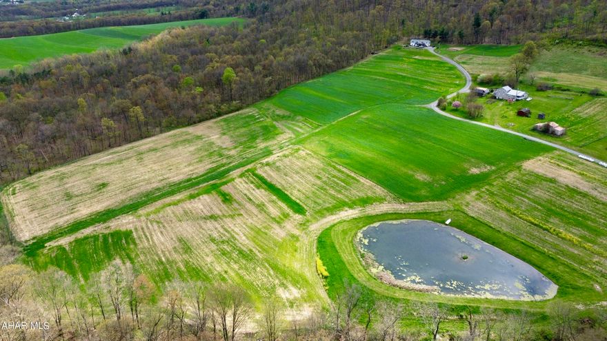 Three-bedroom, 2.5-bath home resting on 31+/- acres, offering beautiful views of the countryside and 20+ acres of tillable land. The home offers an open concept with an eat-in kitchen, dining room, living room, family room, and laundry room. Outside, you will find a large deck, a 1/2-acre pond, and a garden.