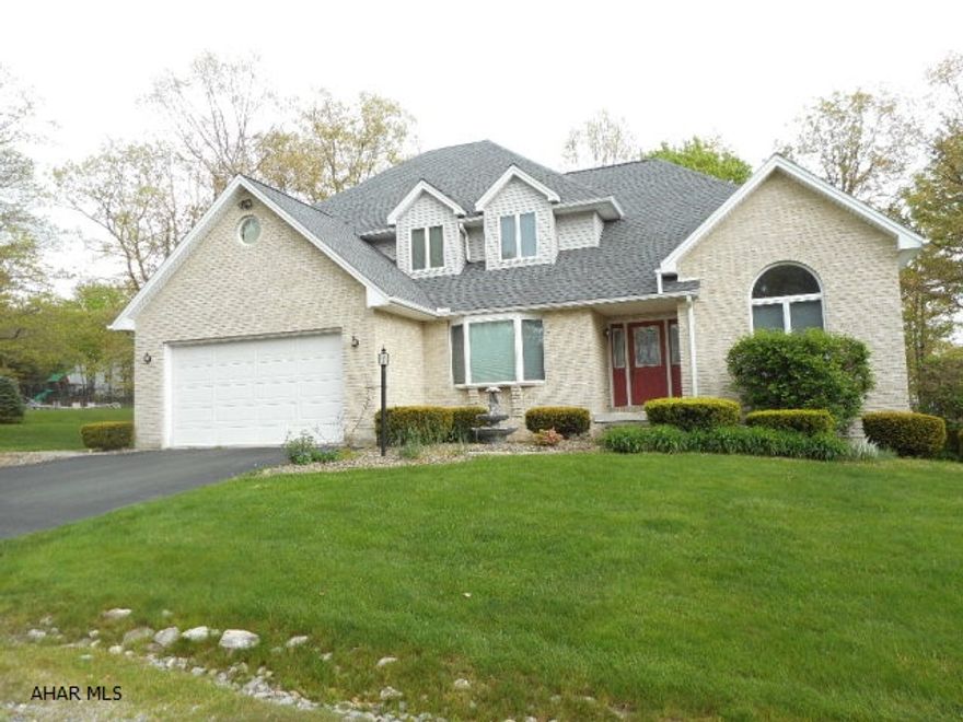 Sylvan East - This custom built home has 4 bedrms and 2.5 baths on a flat, wooded lot. Spacious and bright kitchen with oak cabinetry, solid surface counter tops,island and tile floor. Eating area overlooks the family room with gas fireplace and recessed lighting. Formal living and dining rooms. Convenient first floor laundry and powder room. Master suite features large walk-in closet,master bath w/ Jacuzzi tub, sep. shower and double bowl vanity. Walk-out basement has been pre-plumbed for bath. Spacious finished garage. New roof and hot water heaters. 2 zone heat. This home is conveniently located between Altoona and Hollidaysburg.