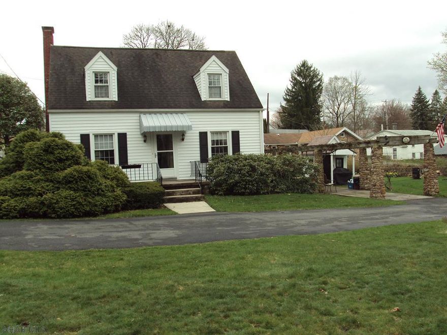 Very nice 3 Bedroom 2 Bath Cape Cod.  Hardwood floors, bedroom and bath on first floor, 2 Bedrooms and Bath on second.  Large Living Room w/ converted gas fireplace.  Formal Dining Room.  Relaxing Sun Room, Riverstone Grape Trellis, Garage with Electric, Gas, Water, Sewage, Fireplace