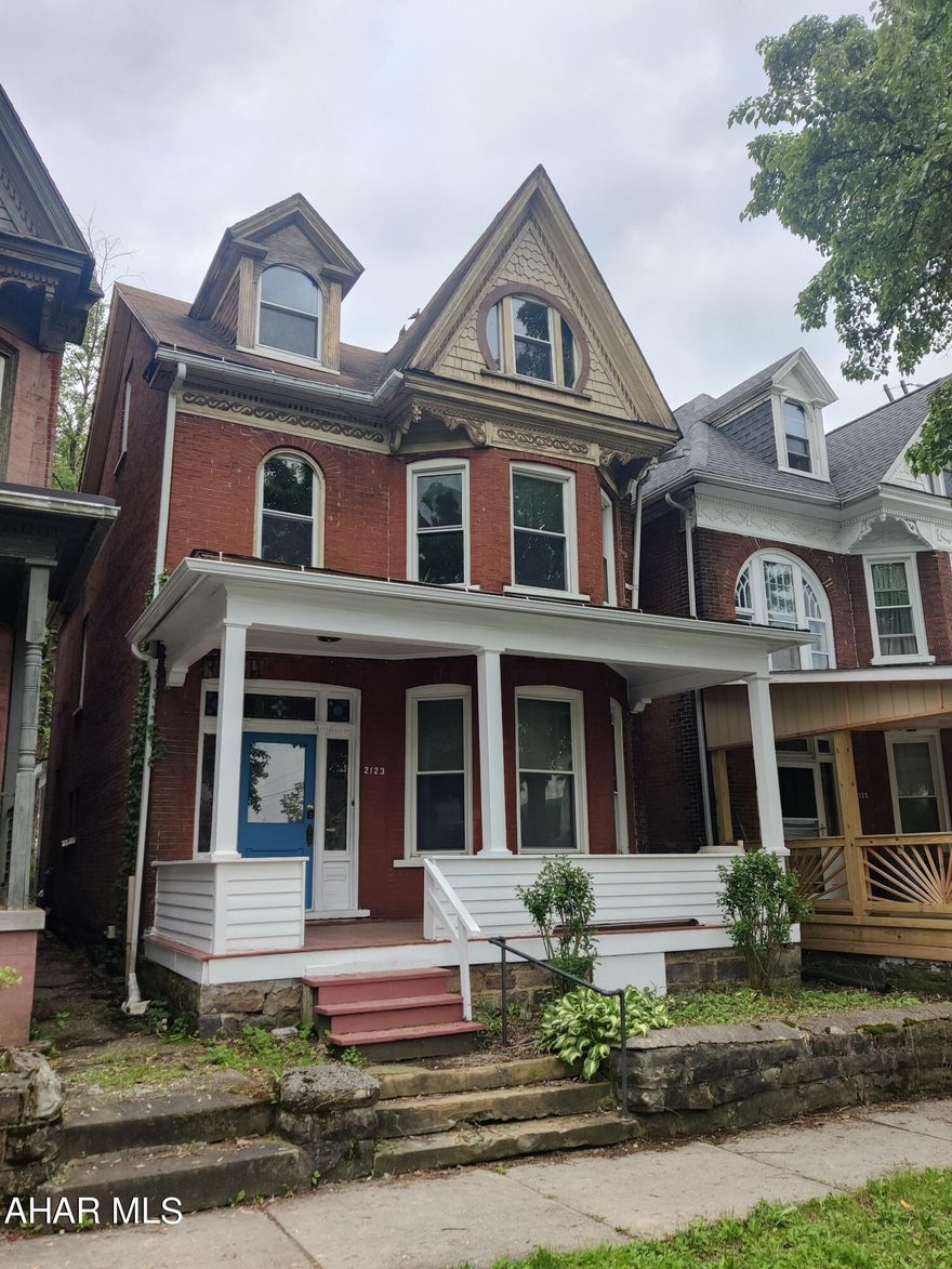 Very Roomy Classic Brick Home: 5 BR 2 Baths. Updated with Fresh Paint Throughout. NO Carpet in the House. Some of the Original Character Continues to Charm with Hardwood Floors, Pocket Doors, Period Light Fixtures, Beautifully Unique Fireplace, and Wood Doors and Trim. Nice Front Porch. Small Back Yard with Great Potential for Relaxing, Entertaining, Flower or Vegetable Gardens, or Playground. Delightfully Low Taxes.