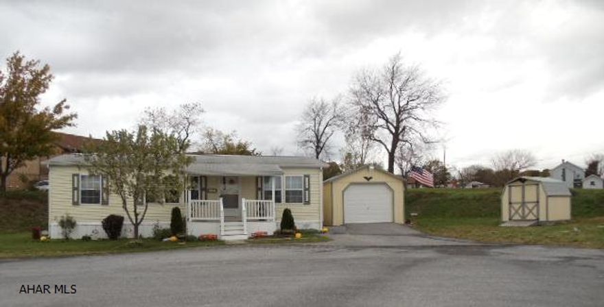 Immaculate doublewide with 3 bedrooms, 2 baths, and vaulted ceilings, at the end of a cul-de-sac. Nice landscaping and front and back porches, 1 car garage & shed. Fuel type is Kerosene. J-101