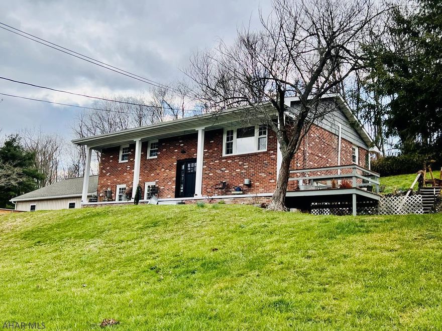 This beautiful, brick, split level home is unlike most others. Completely updated with custom work throughout, you'll feel like you're living in a brand new home. Enjoy the spacious, open floor plan upstairs, or the privacy of the owners suite downstairs, with private entrance and a walkthrough closet with his and her entrances. The en suite bath features a large, open, walk in shower with dual shower heads.The 2 car garage is a great new addition along with the refinished drive and custom built retaining wall. There are all new doors, flooring, windows and gutters throughout.  There is no shortage to the updates and custom work on this home. Only minutes from Rocky Gap Casino and Cumberland MD.