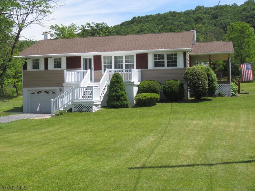 This well maintained 3 bedroom raised ranch has so much to offer in its quiet country setting. The 1.29 acre corner lot not only has the house with covered deck but also a 2 car detached garage w/ carport large enough to store a boat, camper or small RV.  There are 2 deeded lots being sold as one parcel that totals up to 1.29 acres. Public sewer is included. Oil fired hot water baseboard  heat.  The home has original hardwood floors, numerous upgrades to the kitchen, bathroom, roof and more. This home is move in ready. All taxes, Sq. footage and land quantities are estimated. Buyer to verify them.