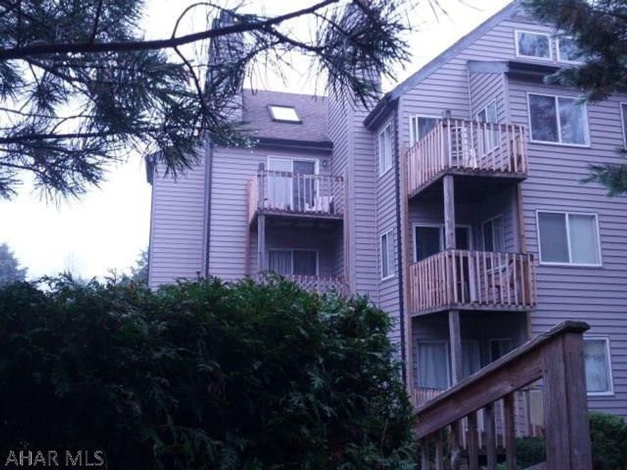 Third-floor end unit condo with spiral stairs to loft.  Nice Wooded view from balcony and from window at alcove bed.  Sleeps 6, has skylight and is fully furnished. Electric system is breakers.   $255/mo HOA dues include use of outdoor & indoor pools, hottubs, tennis court, outside maintenance & trash removal.  J-418