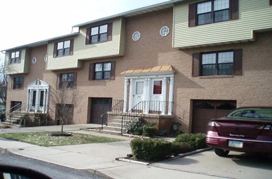 Intown Living. Townhouse with 2BR, 1.5BA, basement garage, and central air.