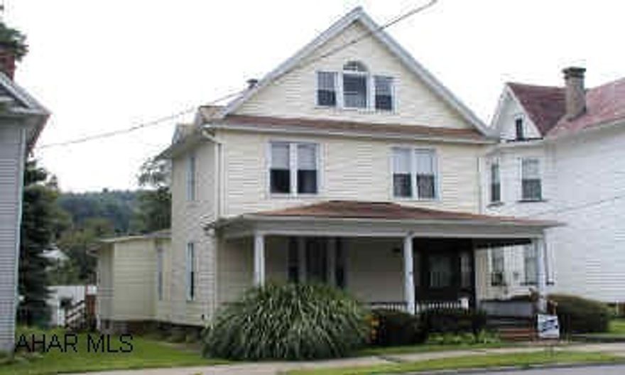 Nice large home 3 bedrooms, 2 baths, Hickory cabinets in kitchen, 2 car garage. Foyer with leaded glass doorway, naural woodwork, hardwood floors, appliances, gas HW heat with 2 zones, blown-in insulation, insulated windows, vinyl siding, deck, 2 car garage.