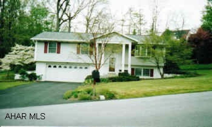 Lovely 3BR, 2.5BA home in Holiday Manor.  Built-in mini-kitchen and gest area in great room, C/A, newer kitchen, lots of built in closet space, hardwood floors, plaster walls, corian, tile floors.  A must see, call Patty today. Lovely home in Holiday Manor, don't just drive by this one.  Corian in kitchen and bathrooms, hardwood floors in living room and dining room, tile floor in kitchen, C/A, built in cabinets in great room and sun room.  Seller is selling "AS IS".
