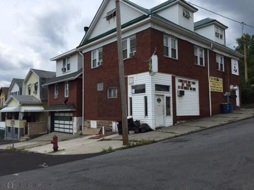 Molly Maguires Pub. Fully functional turnkey operation includes 2 story brick building with all restaurant, and liquor license. Rental income from two 2 bedroom apartments above. Newer central air and roof. Lot (30 x 120) across street included.