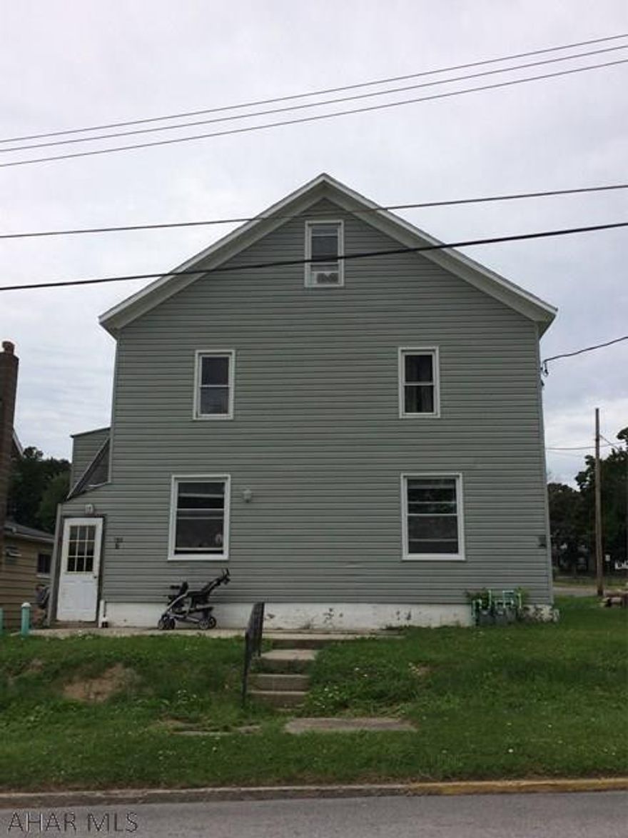 Great Investment property. The top unit has had a complete renovation. New kitchen, with new cabinets and appliances that are included, lighting and flooring, bathroom is completely new as well.  All new flooring throughout unit.  This well maintained large duplex on a corner lot is perfect for you to live in one and rent out the other. Separate utilities, new roof and new electrical panel boxes. Recently updated kitchens and baths. Refrigerator and stove are included for each unit. Also each unit has laundry hook-ups. Off street parking. Call today.