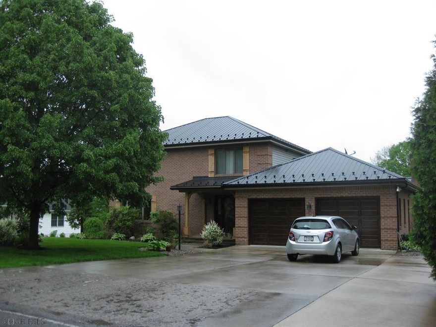 Don't miss out on this gorgeous 2 story brick home in a very desirable area. The home features hardwood flooring throughout, a cherry kitchen with granite countertops, a step down family room with stone fireplace, and a large finished basement that includes a full bath and huge living space.