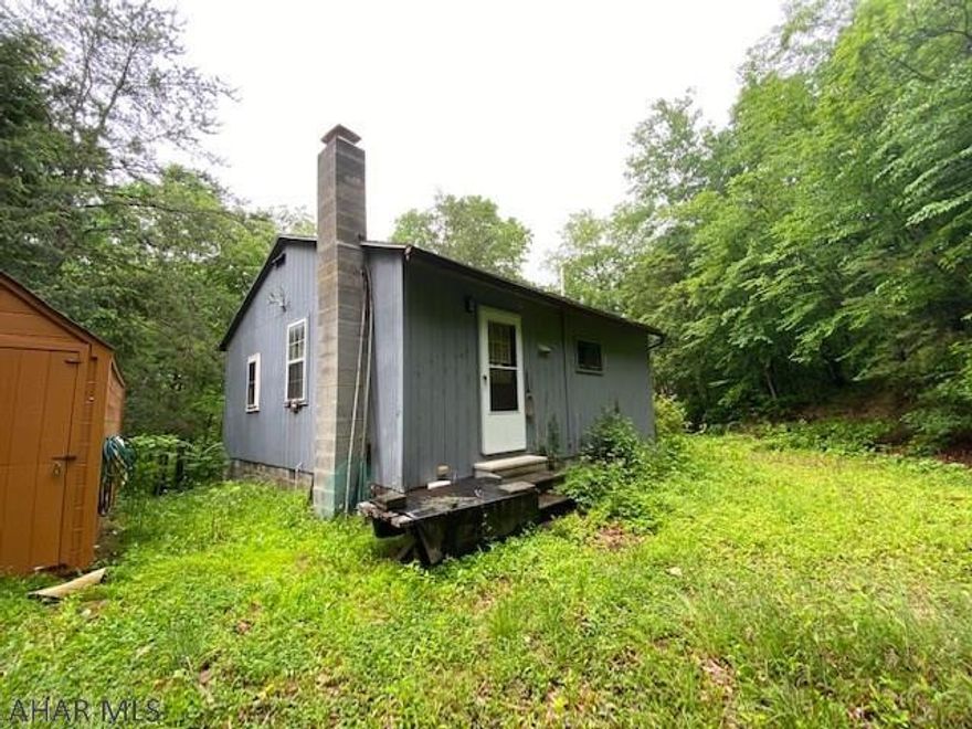 This little cabin, located close to Shy Beaver boat launch, is the perfect opportunity to be close to the lake yet with a little privacy of your own. This two bedroom cabin would be a great place to turn into a retreat that you will never want to leave. Of course conveniently located to Lake Raystown, many state parks and forest, bike paths, hiking and so much more makes this one desirable vacation/getaway spot. The outdoor adventures patiently awaits your arrival, come take a look today!