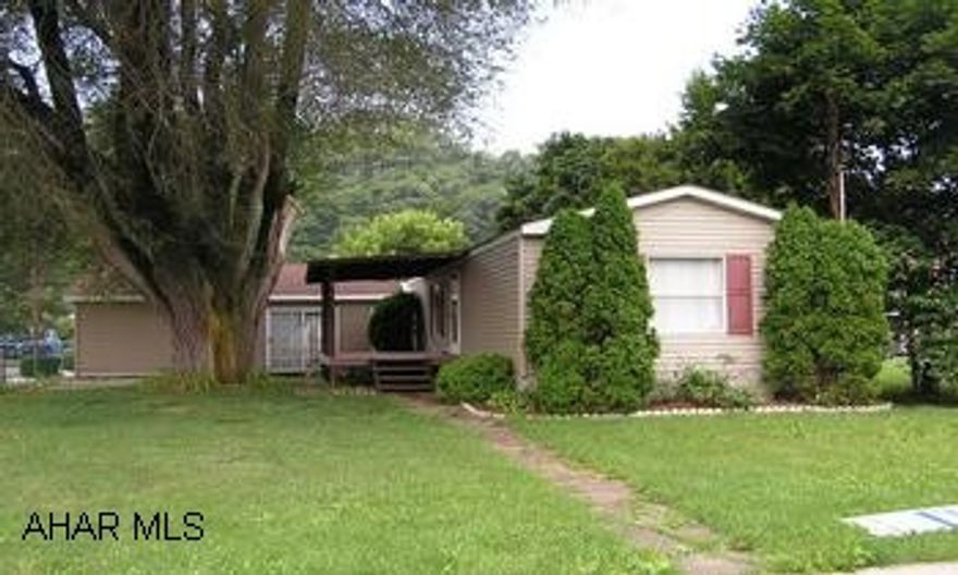 Conveniently located 2BR/2BA mobile home on full foundation with attached garage in downtown Hyndman. Offered "As-Is" Amenities include front porch, rear deck, central air, gas fireplace in living room, MBR has separate shower and garden tub.