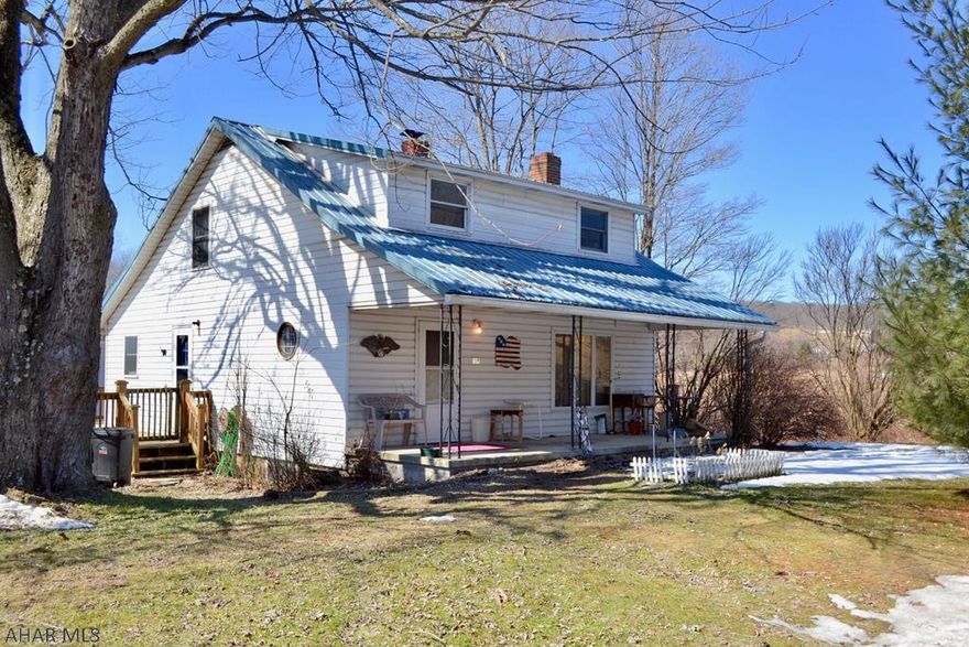1.5 story vinyl sided home on a .842 acre lot with an oversized 1.5 car garage and fenced yard.   Laminate flooring on first floor with spacious kitchen and a dining and living room focused around a large wood stove.  First floor laundry with washer and dryer included.   Nice side and back deck with storage building, newer metal roof, furnace and electrical service.  1,000 carpet allowance for 2nd floor.