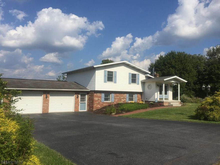 Large 4BR, 4 level home. Located on quiet dead end but just minutes to shopping. Sunny kitchen with cherry cabinets. Finished lower level multi use area. Alternative heat source, wood stove. Nice size lawn which can be enjoyed from the panoramic 4 level deck of the back of the home.  Oversized 2 car garage, work area. 12x24 shed.