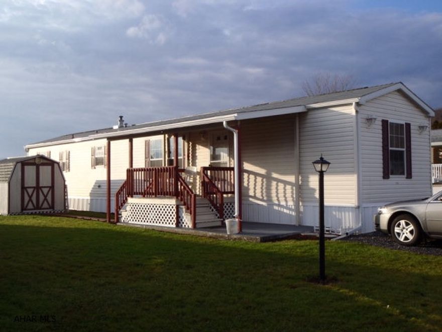 Great Mobile home in Greendown Acres.  Very reasonable lot rent at $220.  New Covered Porch.  Large Storage shed included.  New carpeting throughout.  Central Air Conditioning.  All appliances included.  Priced for quick sale.