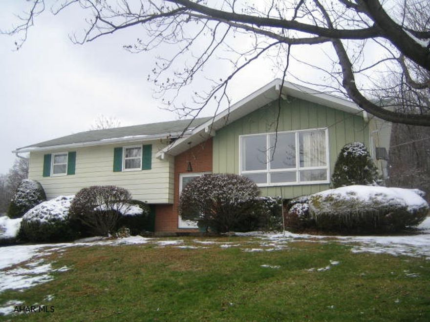 Privacy can be yours with this lovely Duncansville Bi-Level home on .8 acres with great view! Large Living room with dining combo area plus beautiful eat-in Kitchen with dining peninsula. Fabulous finished basement features Family room w/ wood burning FP, 3/4 bath, den and laundry room. 1 car integral garage w/ opener, enclosed rear porch, shed, private lot on dead end street in very nice area! 1 year home warranty.