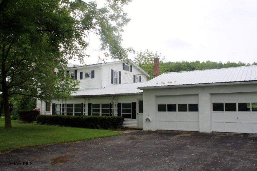 2 story farm house with well-maintained features and charm. 10.76 acres, easy access and a 68x39 bank barn make this a desirable property for a full-time residence or hobby farm. Acerage is open, maintained and nicely set for horses, hobby or ready for new planting. House has some built-ins and 2 zoned heating.