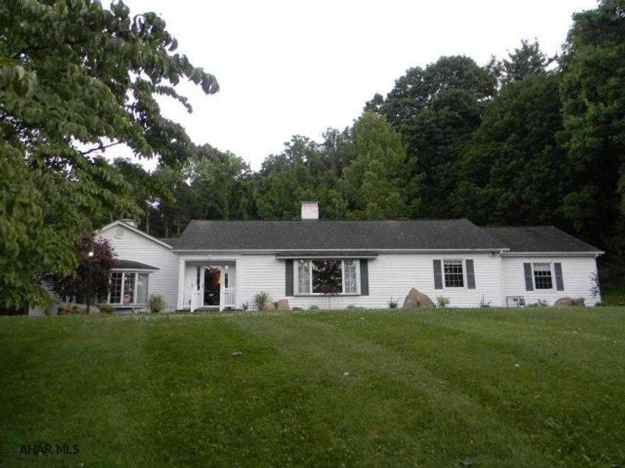 Exceptional ranch home resting on 3.729 acres. Scenic, private location at the top of Juliana Heights within walking distance to the downtown area, Bedford Elks Country Club and near Bedford Springs Resort. Newly updated kit with granite counters, tile backsplash, deluxe breakfast bar, large Family Room open to the kit with brick hearth fireplace and large bay window, formal living room with HW floors and picture window, D.R. with HW floors, master BR suite w/walk-in closet, custom master bath with ceramic tile walk-in shower, updated 1st level laundry, 1 additional updated full bath & 2 additional half baths. Finished bsmt w/custom rec.room, game rm and full bath. Natural gas heat, CA, security system & custom patio w/ firepit. Beautifully updated home that is absolutely move-in ready