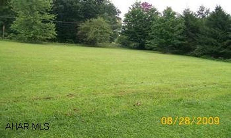 tax id # 21-26-102 Sewage tap in fee is $1,500 and water tap in fee is $750.00.  Access to the lot is granted from Penndot.