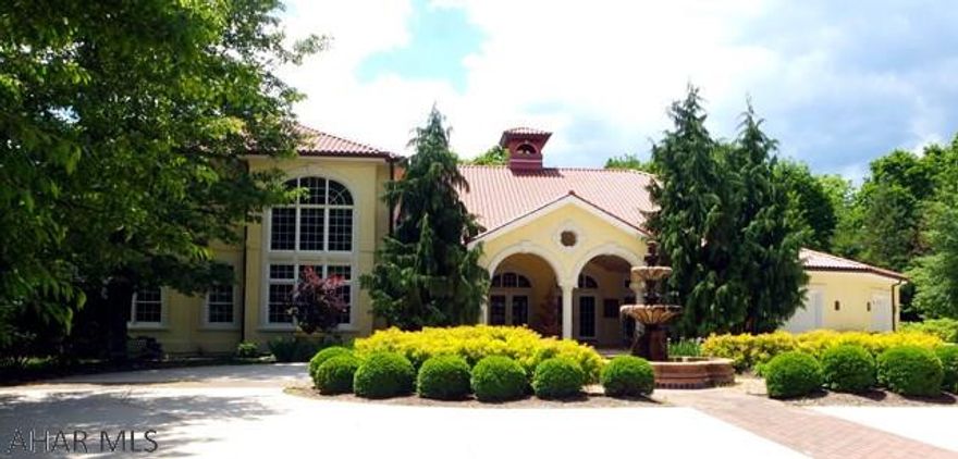 Nestled in the heart of Holbg. is a home built in the style of a Tuscany Villa. Sitting on 5+acres in a very private location. This elegant property dominates the surroundings & offers dramatic views of the wooded hills. The amazing interior decor is filled with rich woods, cool hand thrown tile floors, majestic windows & vaulted ceilings. The wood moldings are a work of excellent craftsmanship. A La Cornue stove in the gourmet kitchen. An indoor pool that opens to the outdoor gardens with just the touch of a button. The Master Bedroom, walk-in closet & en suite are fit for a king,  5 bedrms./6.5 baths.  The wine cellar is amazing. Balconies, pergolas, tiles patios, a 3 car garage off of a circle drive with a center fountain & garden. Must be seen to experience the rare find that it is!.