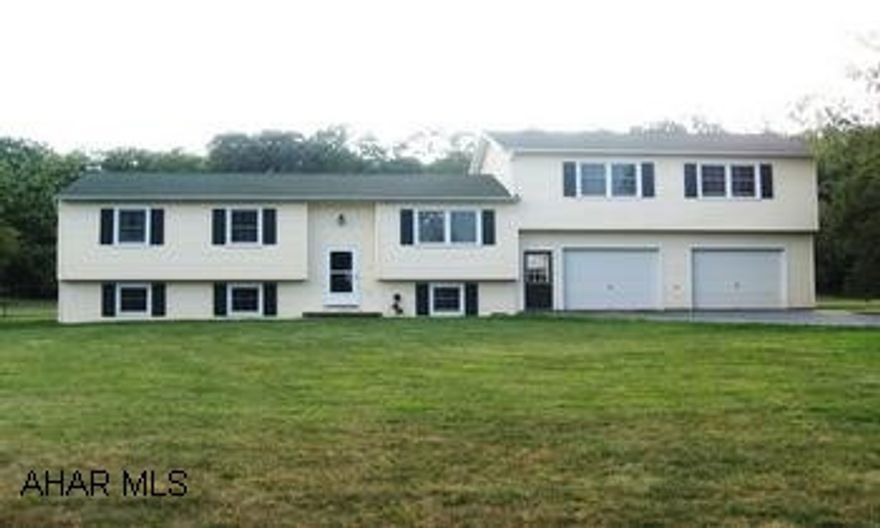 COUNTRY LIVING ON 2 ACRES. 4 BR, 1.5 BATH BI-LEVEL WITH ALL THE NEW INTERIOR FEATURING NEW CHERRY KITCHEN, NEW BATHS, WINDOWS, FURNACE, FLOORING, ELECTRIC, PLUS A 2 CAR GARAGE. CALL LORA FOR MORE INFO. 814-931-1018.