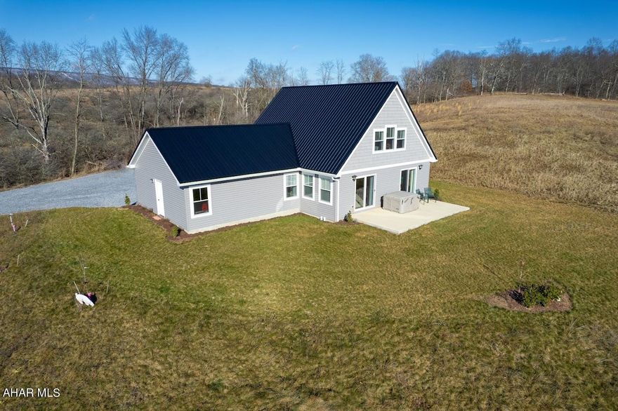 Newly constructed (2022) 2 story home on 3.24 acres offers all the modern convenience of today. This immaculate  hillside home offers mountainous views, peace and serenity. The kitchen cabinetry is solid natural oak accented with new granite countertops and under counter lighting, stainless appliances, reverse osmosis water system and a movable island seating for 4. The fireplace gives ambience to the living area. Spacious main floor master bedroom with walk-in closet.  Bathrooms have marble counters tops. Stackable washer/dryer provides convenience off the bedroom area.  Upstairs is 2 spacious bedrooms, full bath with luxury vinyl flooring. The bonus room/bedroom/reading room provides  spectacular views! This room would be considered the 5th bedroom. Recess LED lighting though out home. The basement would be ideal to finish with higher ceilings and outside access. All doors ways are 36 in doors and the steps upstairs and basement steps are 44 inches wide. The property is deemed as a pollinator field for birds of prey, nearing mountain ( Shaffer Mountain) is considered the 12th largest flyway in America for migrating birds. This home is a must see!!