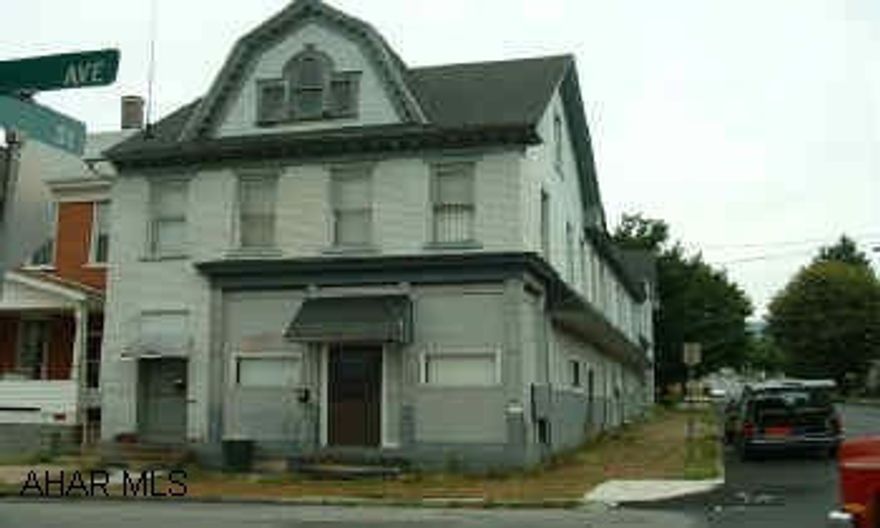 Historically once known as "THE BRADFORD" 2-one bedroom, 3- two bedroom plus vacant brick house at rear- currently vacant but could be duplexed or triplexed.  Call Linda@329-3076 for more information. Tenants pay electric & trash.